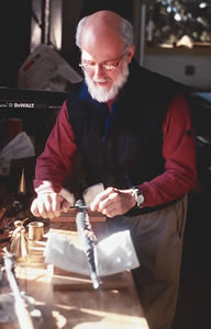 Charles Ruggles in his shop